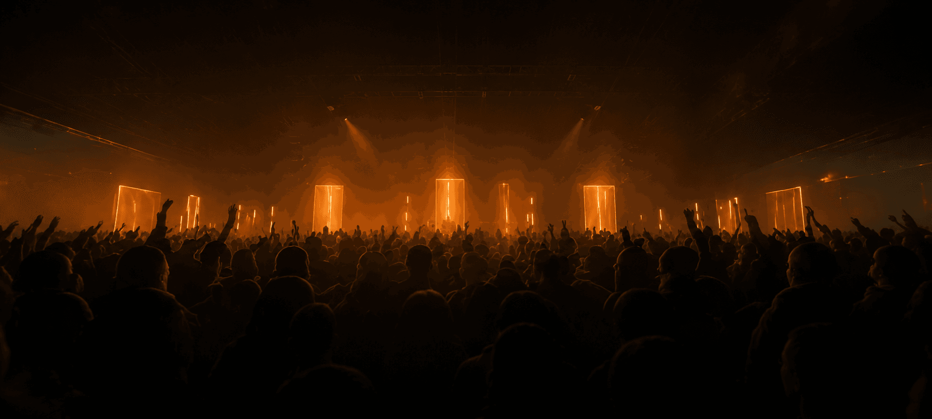 Warm light over a night crowd — the Electronic experience